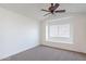A bedroom with neutral carpet and a window at 433 E Utopia Rd, Phoenix, AZ 85024