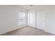 Bedroom showcasing carpeted flooring, a closet, and window with natural light at 433 E Utopia Rd, Phoenix, AZ 85024