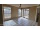 Dining area with tiled floors, multiple windows, and sliding glass door at 433 E Utopia Rd, Phoenix, AZ 85024