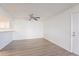 Bright living room featuring wood floors and access to the front door at 433 E Utopia Rd, Phoenix, AZ 85024