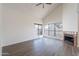 Bright living room with large windows, a cozy fireplace, and modern flooring at 433 E Utopia Rd, Phoenix, AZ 85024