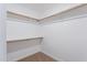 A walk in closet with neutral carpet and shelving at 433 E Utopia Rd, Phoenix, AZ 85024