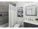 Cozy bathroom featuring tiled shower, modern vanity, and tasteful decor at 44196 W Askew Dr, Maricopa, AZ 85138