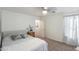 Bedroom featuring neutral carpet and light colored walls and decor at 44196 W Askew Dr, Maricopa, AZ 85138