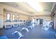Modern community gym with treadmills, weight machines and ceiling fans at 44196 W Askew Dr, Maricopa, AZ 85138