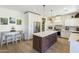 Bright and airy kitchen with stainless steel appliances and a central island at 44196 W Askew Dr, Maricopa, AZ 85138