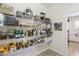 Well-organized pantry with shelving for ample food storage at 44196 W Askew Dr, Maricopa, AZ 85138