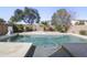 Backyard oasis featuring a private pool surrounded by lush greenery for relaxation and enjoyment at 44196 W Askew Dr, Maricopa, AZ 85138