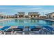 Community pool featuring lounge chairs and pristine water, perfect for relaxation on a sunny day at 4424 S 127Th Ave, Avondale, AZ 85323