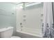 Clean bathroom showcases a shower-tub with white tile and a shower curtain at 4960 S Wade Dr, Gilbert, AZ 85298