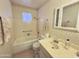 Bathroom featuring a shower-tub combo and a single sink vanity at 5828 E Dallas St, Mesa, AZ 85205
