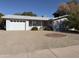 Charming single-story home with a well-maintained front yard and attached two car garage at 5828 E Dallas St, Mesa, AZ 85205