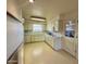 Classic kitchen featuring bright white cabinetry, and ample counter space at 5828 E Dallas St, Mesa, AZ 85205