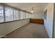 Cozy sun room featuring built-in cabinets, carpet flooring and ample natural light at 5828 E Dallas St, Mesa, AZ 85205