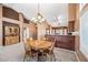 Formal dining area featuring a chandelier and view to the kitchen at 7515 W Jenan Dr, Peoria, AZ 85345