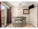 Cozy dining room features a modern chandelier, seating for six, and sliding door at 7977 W Wacker Rd # 171, Peoria, AZ 85381