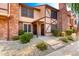 Traditional two-story home featuring a combination of brick and stucco and landscaped front yard at 7977 W Wacker Rd # 171, Peoria, AZ 85381