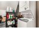 Laundry area equipped with a stacked washer and dryer, and storage at 7977 W Wacker Rd # 171, Peoria, AZ 85381
