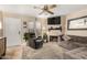 Inviting living room featuring a fireplace, recliner, plush sofa, and neutral decor at 7977 W Wacker Rd # 171, Peoria, AZ 85381
