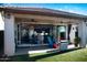 Covered patio with outdoor seating and grill, seamlessly blending indoor and outdoor living at 808 E Constance Way, Phoenix, AZ 85042