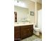 Neutral bathroom featuring a double sink vanity, large mirror, and a shower with a patterned curtain at 808 E Constance Way, Phoenix, AZ 85042