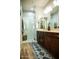 Spacious bathroom with dual vanities, a large glass-enclosed shower, and modern fixtures at 808 E Constance Way, Phoenix, AZ 85042