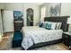 Comfortable bedroom with a plush bed, soft rug, and view to the bathroom at 808 E Constance Way, Phoenix, AZ 85042