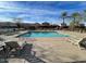Large community pool featuring plenty of lounging chairs to relax poolside at 808 E Constance Way, Phoenix, AZ 85042