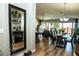 An open concept dining room with wood floors and modern decor makes for a warm and inviting space at 808 E Constance Way, Phoenix, AZ 85042