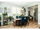Elegant dining room featuring a modern chandelier and an adjacent shelving display at 808 E Constance Way, Phoenix, AZ 85042