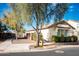 A single-story home with a well-maintained yard, walkway, and manicured landscaping at 808 E Constance Way, Phoenix, AZ 85042