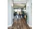 Hallway view of an elegant dining room featuring modern decor and hardwood floors at 808 E Constance Way, Phoenix, AZ 85042