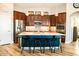 Modern kitchen featuring stainless steel appliances, granite countertops, and a center island with seating at 808 E Constance Way, Phoenix, AZ 85042