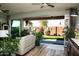 Bright living room with hardwood floors and sliding glass doors leading to the backyard at 808 E Constance Way, Phoenix, AZ 85042