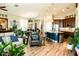 Open-concept living room with a view of the kitchen and dining area, ideal for entertaining guests at 808 E Constance Way, Phoenix, AZ 85042
