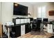 Home office featuring multiple monitors, workspace, and ample storage at 808 E Constance Way, Phoenix, AZ 85042