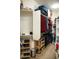 Organized walk-in closet featuring shelving, hanging racks, and ample space for clothing and accessories at 808 E Constance Way, Phoenix, AZ 85042