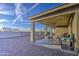 Covered patio with an outdoor kitchen and grill, perfect for entertaining and enjoying the backyard at 8420 S 69Th Ln, Laveen, AZ 85339