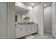 Well-lit bathroom showcasing a double vanity with granite countertops and ample storage at 8420 S 69Th Ln, Laveen, AZ 85339