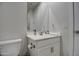 Bathroom with white vanity, chrome hardware, and a framed mirror at 8420 S 69Th Ln, Laveen, AZ 85339