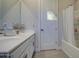 Bathroom with a single sink vanity, brushed nickel faucet, and shower-tub combo at 8420 S 69Th Ln, Laveen, AZ 85339
