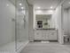 Elegant bathroom featuring a glass-enclosed shower and a double vanity with granite countertops at 8420 S 69Th Ln, Laveen, AZ 85339