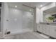 Modern bathroom with a glass-enclosed shower and sleek vanity with granite countertop at 8420 S 69Th Ln, Laveen, AZ 85339