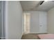 Neutral bedroom featuring plush carpet, an ensuite bathroom, and a large closet at 8420 S 69Th Ln, Laveen, AZ 85339
