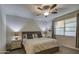 Comfortable bedroom featuring a cozy bed, nightstands, and a window for natural light at 8420 S 69Th Ln, Laveen, AZ 85339