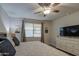 Bedroom featuring a ceiling fan, a dresser, and neutral decor at 8420 S 69Th Ln, Laveen, AZ 85339