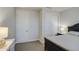 Cozy bedroom featuring a dark-framed bed, dual closets, and an ensuite bathroom at 8420 S 69Th Ln, Laveen, AZ 85339