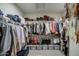 Spacious walk-in closet with ample storage space for clothes, shoes, and accessories at 8420 S 69Th Ln, Laveen, AZ 85339