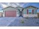 Well-maintained single-story home with brick driveway, low maintenance front yard and two car garage at 8420 S 69Th Ln, Laveen, AZ 85339