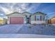 Charming single-story home featuring a well-manicured front yard, brick accents, and attached two-car garage at 8420 S 69Th Ln, Laveen, AZ 85339